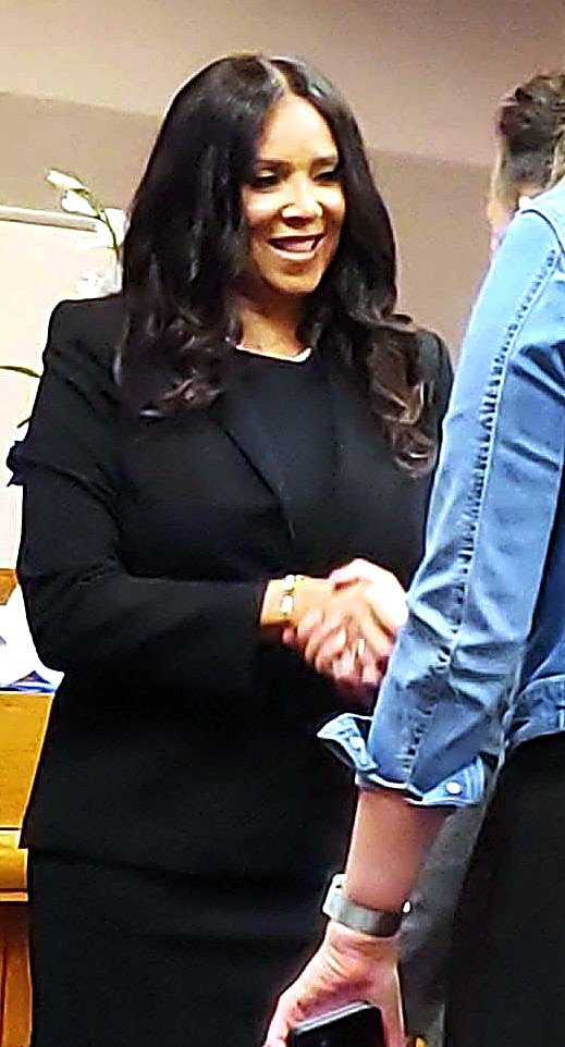 Judge Rachelle D. Carter greeting a colleague in court